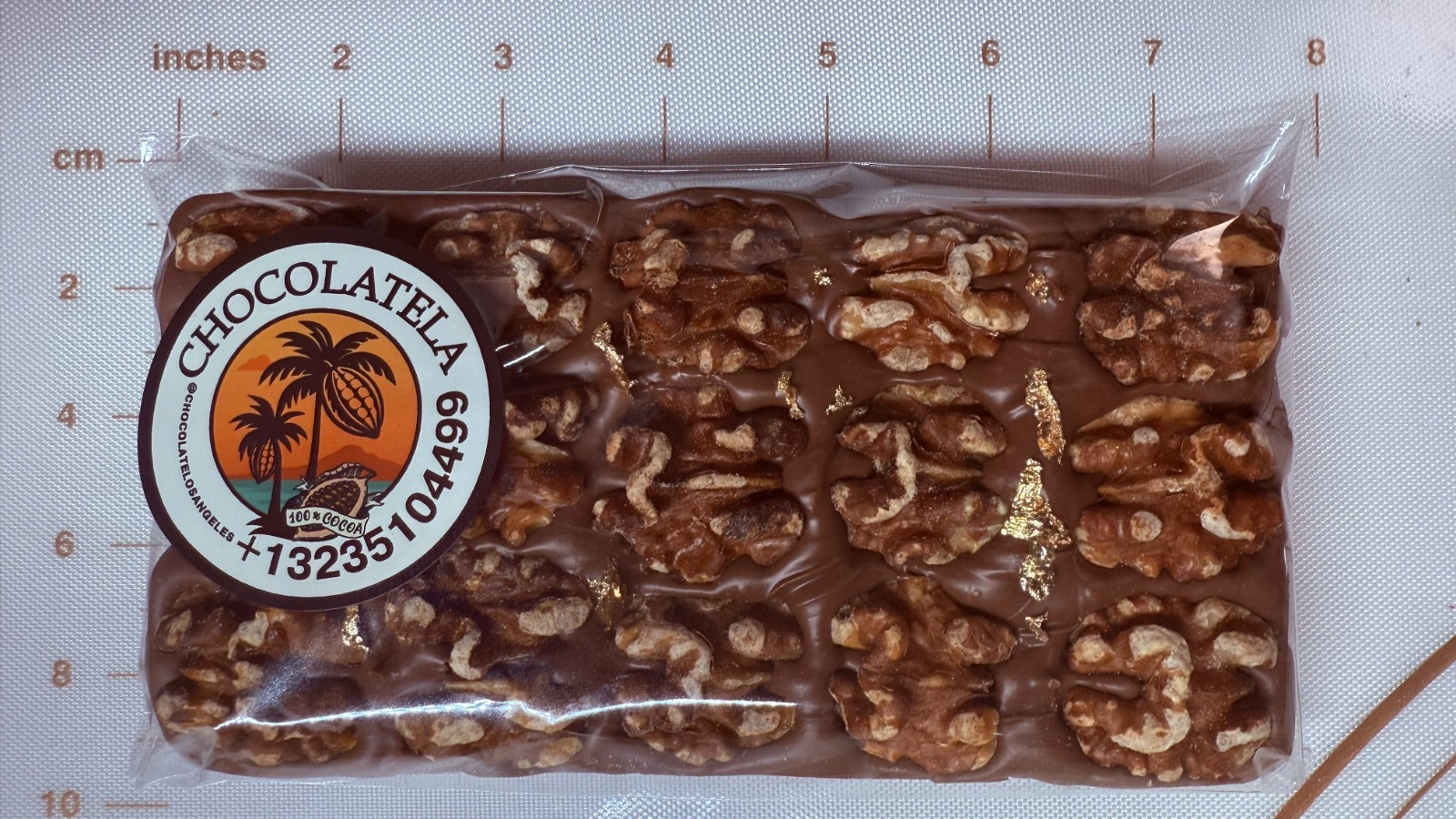 Big 250g Milk artisan chocolate Bar filled with hand roasted crunchy Walnuts .