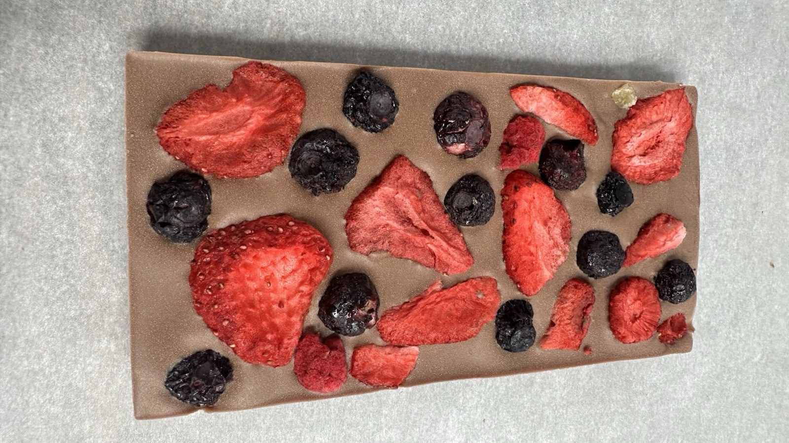 Milk chocolate Bar with Strawberry Bluberry handcrafted chocolate 100gr .